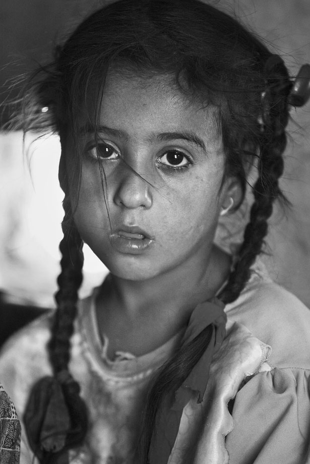 6/21/03 -Village- Noger Beshar, 6 at home in Abdullah's Village outside Al-Kut in south-central Iraq.  The village has no electricity or running water. Photograph by Michael Madrid, USA TODAY.